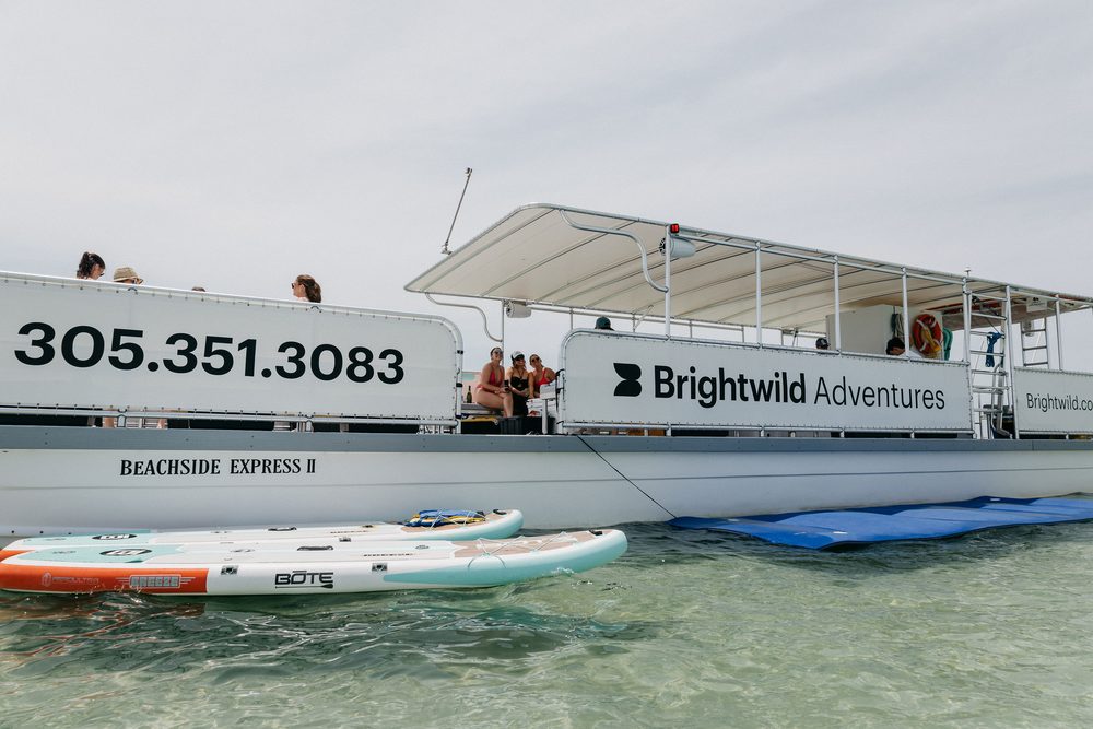 The boat at anchor with paddleboards