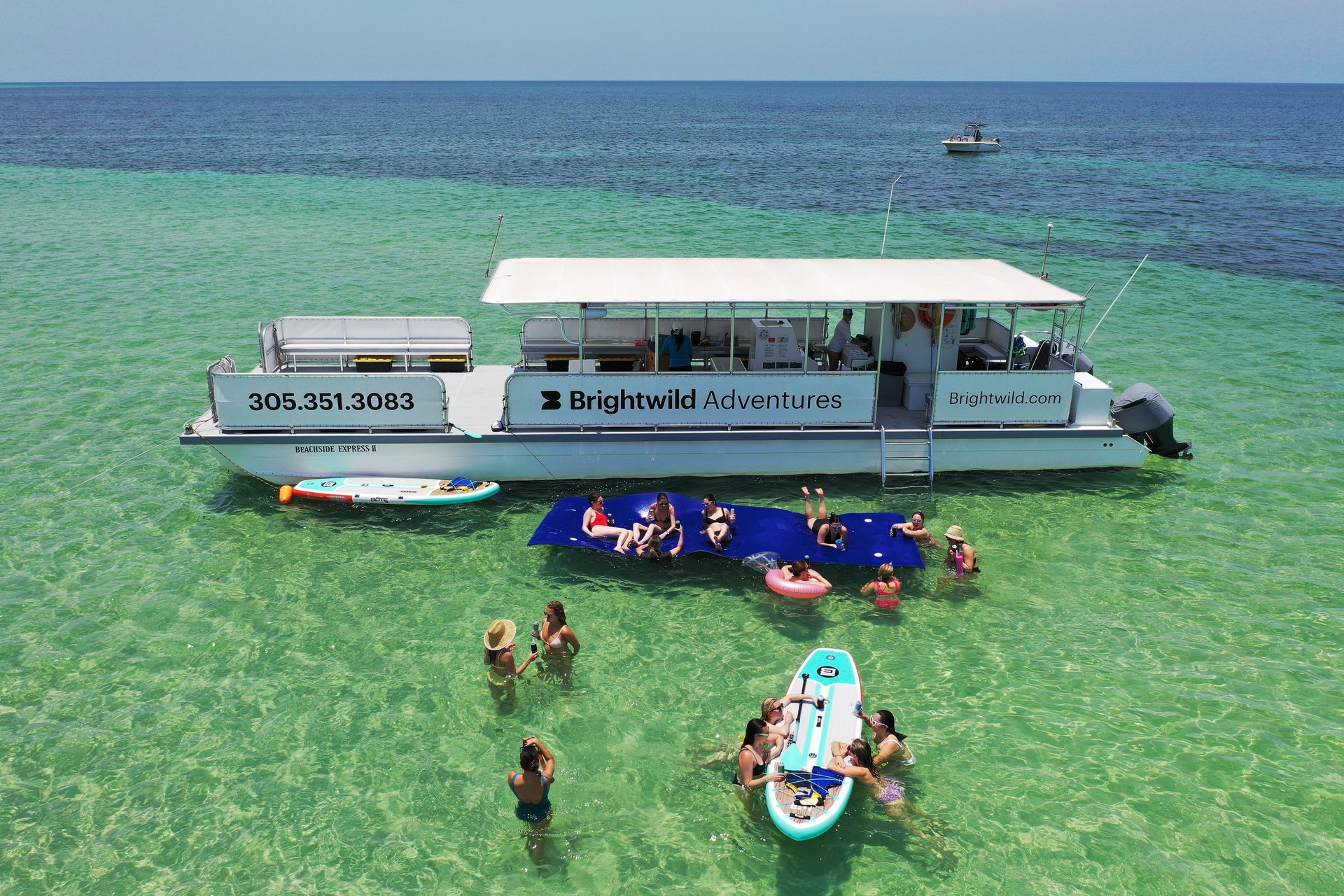 Aerial view of the boat and the lily pad mat at the sandbar